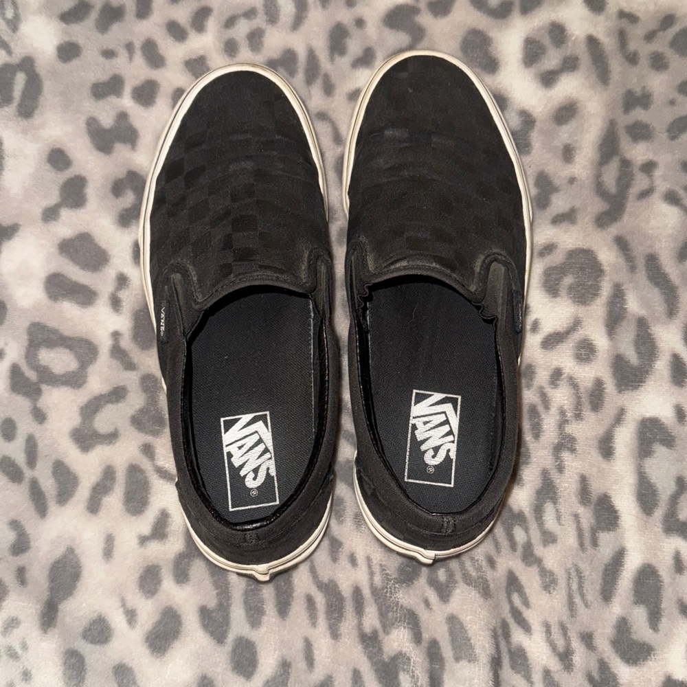 Black and gray checkered slip on Vans